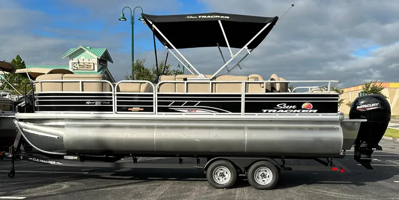 Slide: The Image of 2023 Sun Tracker SportFish 22 XP3 pontoon boat with canopy and trailer. - 8