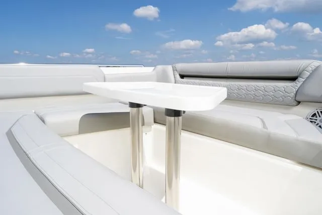 Slide: The Image of Luxurious seating area on the 2024 Tiara Yachts 38LS with a sleek table. - 17