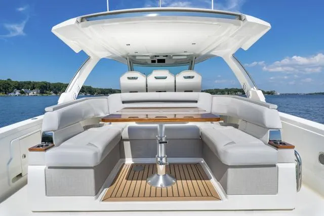 Slide: The Image of 2024 Tiara Yachts 38LS luxury boat with spacious seating and modern design. - 7