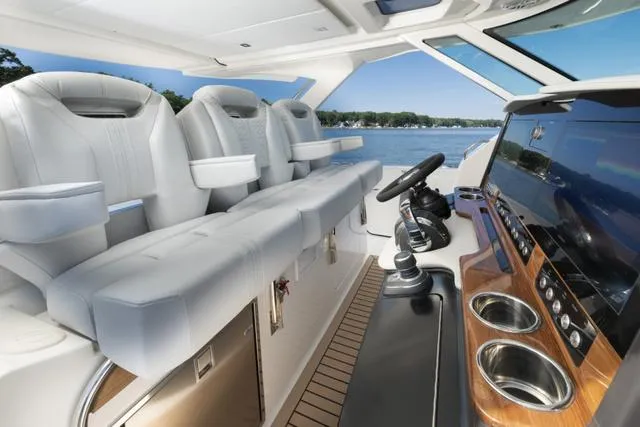 Slide: The Image of 2024 Tiara Yachts 38LS cockpit with luxurious seating and advanced navigation system. - 8