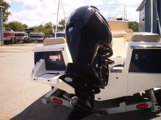 Slide: The Image of 2023 Scout 195 Sportfish boat with powerful outboard motor on trailer. - 3