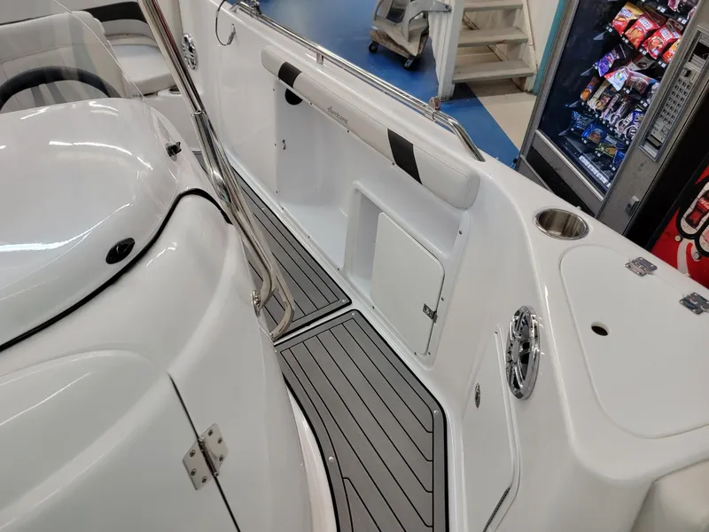 Slide: The Image of 2024 Hurricane SunDeck Sport CC 231 OB interior, white seating, and non-slip flooring. - 10