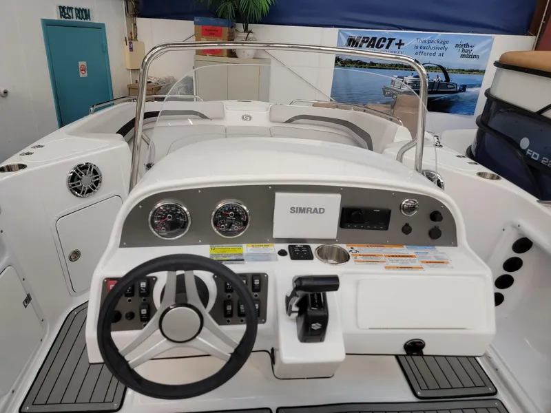 Slide: The Image of 2024 Hurricane SunDeck Sport CC 231 OB boat interior seating area. - 14