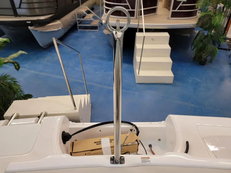 Slide: The Image of 2024 Hurricane SunDeck Sport CC 231 OB boat interior seating and storage area. - 21