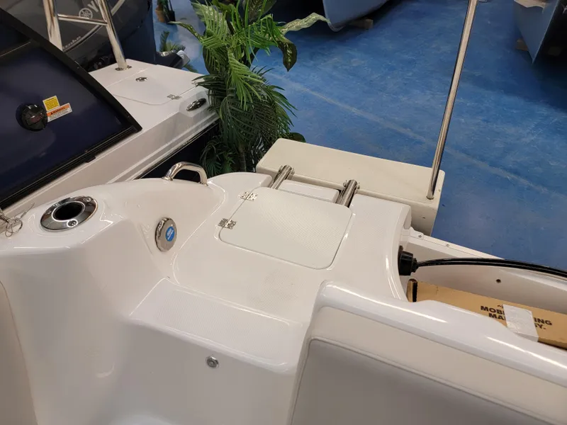 Slide: The Image of 2024 Hurricane SunDeck Sport CC 231 OB boat interior with stainless steel ski tow bar. - 22