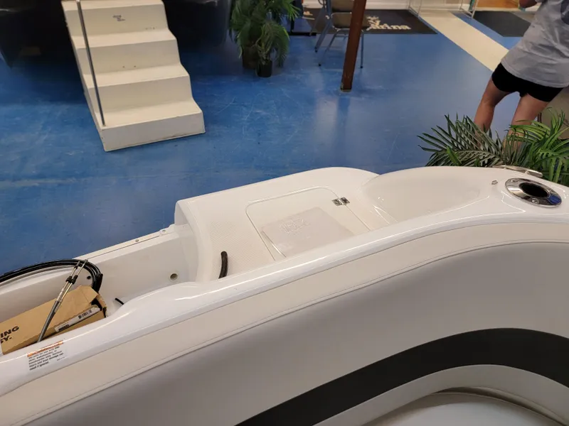 Slide: The Image of 2024 Hurricane SunDeck Sport CC 231 OB boat interior with swim platform and ladder. - 23