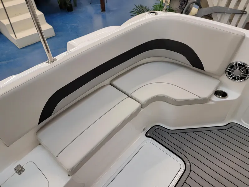 Slide: The Image of 2024 Hurricane SunDeck Sport CC 231 OB boat interior at a showroom. - 24