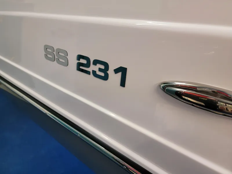 Slide: The Image of 2024 Hurricane SunDeck Sport CC 231 OB boat interior with spacious seating and modern design. - 27