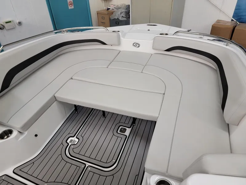 Slide: The Image of 2024 Hurricane SunDeck Sport CC 231 OB boat displayed in showroom. - 4