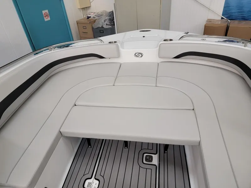 Slide: The Image of 2024 Hurricane SunDeck Sport CC 231 OB boat interior with cushioned seating and non-slip flooring. - 5
