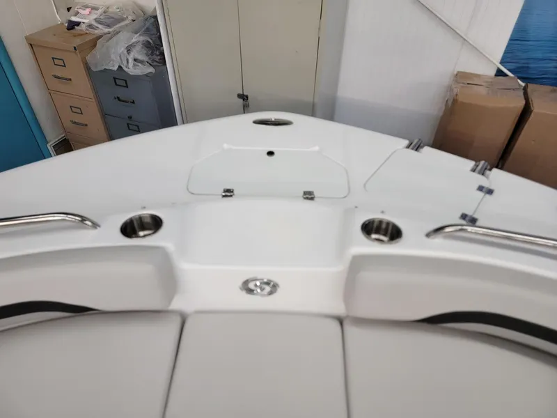 Slide: The Image of 2024 Hurricane SunDeck Sport CC 231 OB boat interior with cushioned seating. - 6