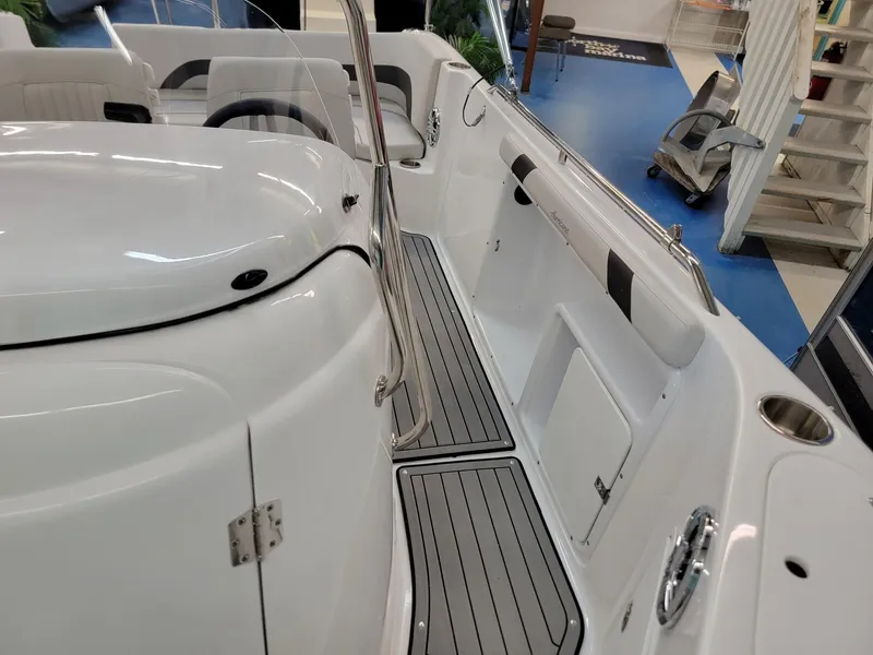 Slide: The Image of 2024 Hurricane SunDeck Sport CC 231 OB interior, featuring sleek seating and modern design. - 9