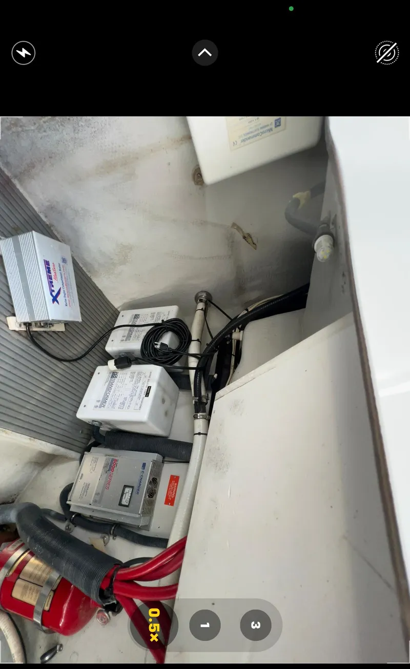 Slide: The Image of Engine compartment of a 2004 Cobalt 360 boat with electrical components and wiring. - 31