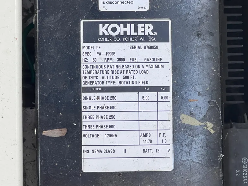 Slide: The Image of Kohler generator model 5E specifications label on a 2004 Cobalt 360 boat. - 33