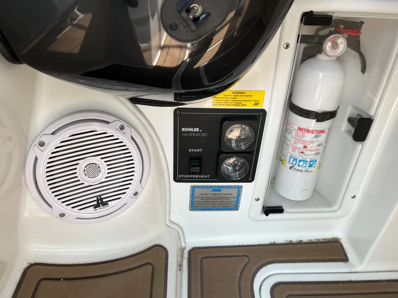 Slide: The Image of Control panel and safety equipment on a 2004 Cobalt 360 boat. - 37
