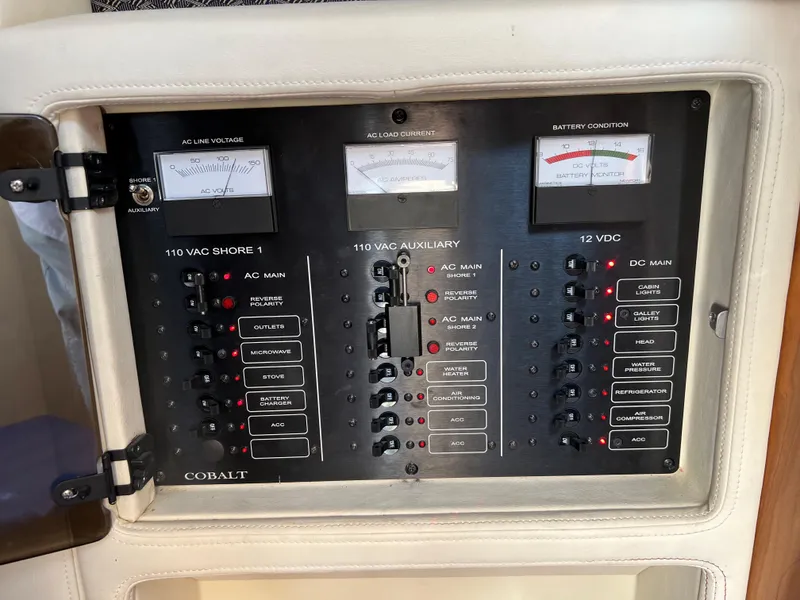 Slide: The Image of Electrical control panel of a 2004 Cobalt 360 boat. - 38