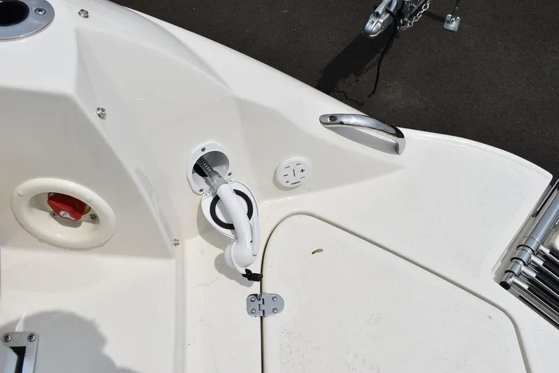 Slide: The Image of 2023 Stingray 231DC boat deck with utility connections and fittings. - 15