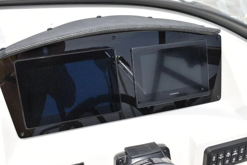 Slide: The Image of 2023 Stingray 231DC dashboard with Garmin navigation display. - 28