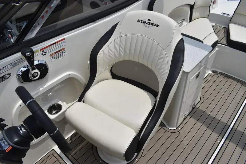 Slide: The Image of 2023 Stingray 231DC boat captain's chair and helm station. - 33