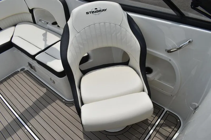 Slide: The Image of 2023 Stingray 231DC boat interior with white and black seating. - 35