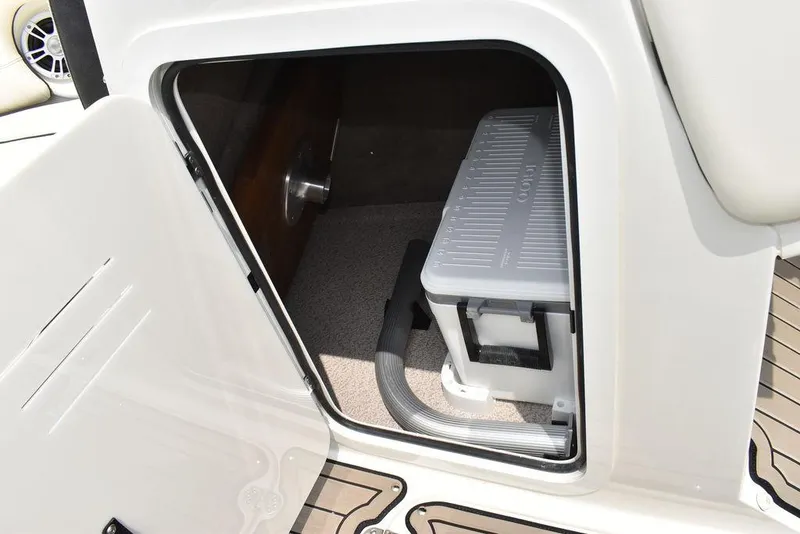 Slide: The Image of 2023 Stingray 231DC storage compartment with cooler and vacuum cleaner. - 42