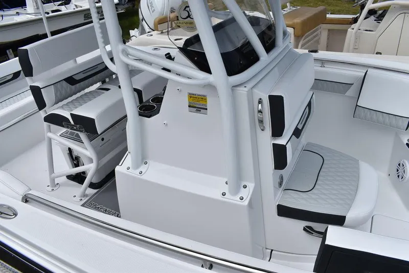 Slide: The Image of 2024 Blackfin 222CC boat interior with seating and console. - 12