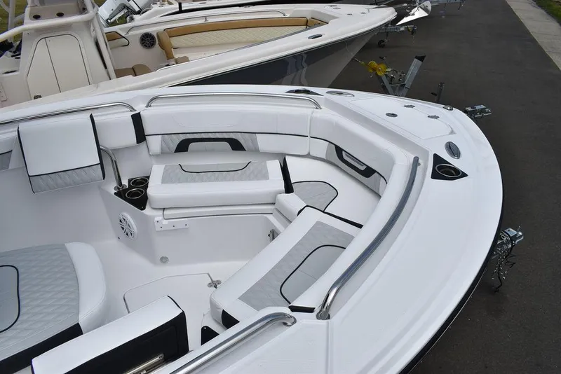 Slide: The Image of 2024 Blackfin 222CC boat interior with cushioned seating and sleek design. - 15