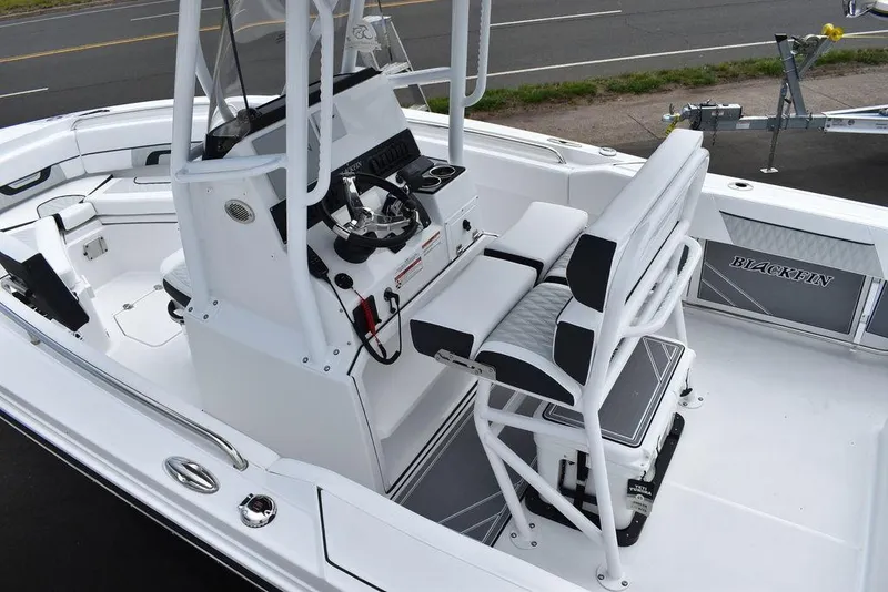Slide: The Image of 2024 Blackfin 222CC boat interior with modern console and seating. - 18