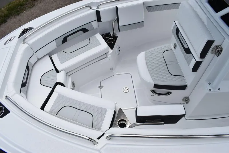Slide: The Image of 2024 Blackfin 222CC boat interior with white cushioned seating and sleek design. - 20