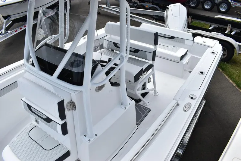 Slide: The Image of 2024 Blackfin 222CC boat interior, featuring sleek white design and modern console layout. - 21