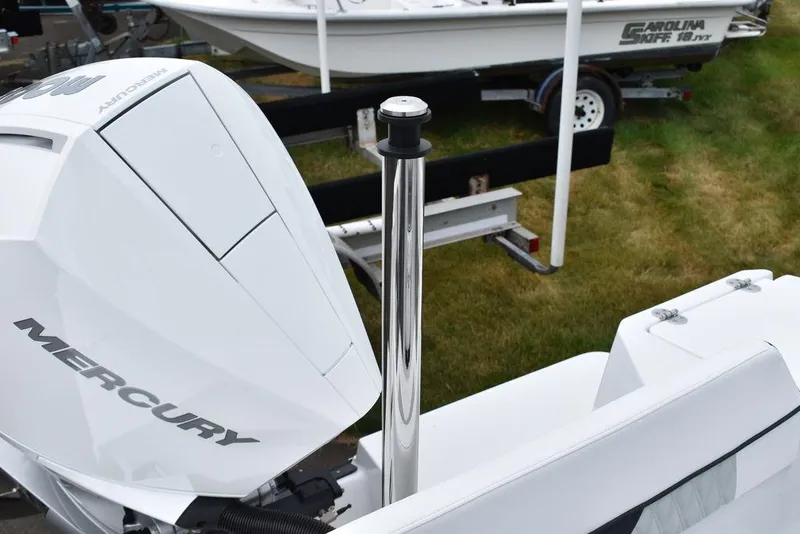 Slide: The Image of 2024 Blackfin 222CC boat with Mercury engine, displayed outdoors. - 30
