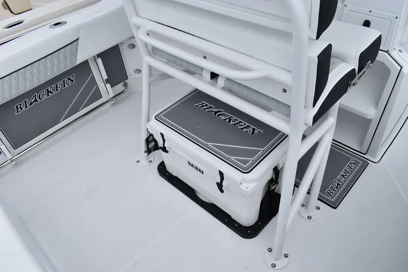 Slide: The Image of 2024 Blackfin 222CC boat interior with branded seating and storage. - 34