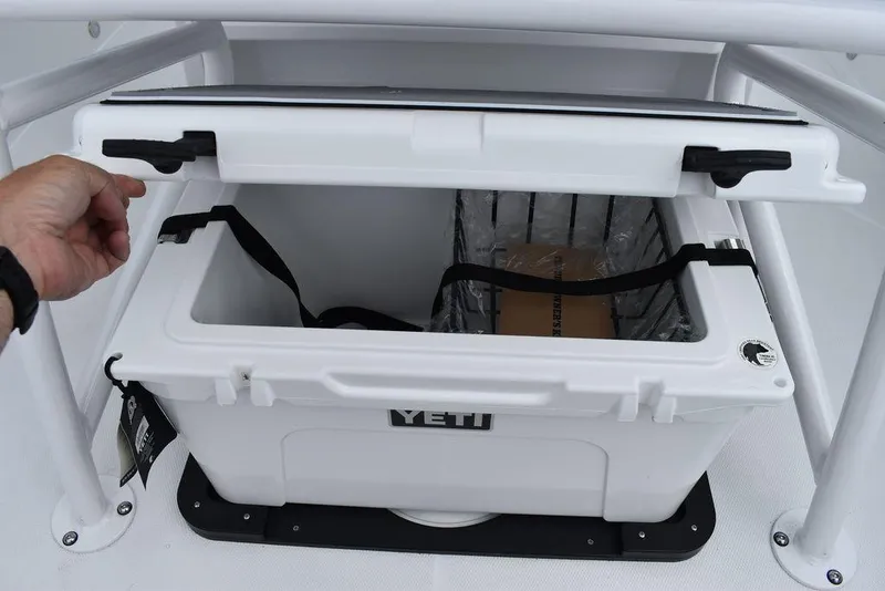 Slide: The Image of White Yeti cooler inside 2024 Blackfin 222CC boat storage compartment. - 36