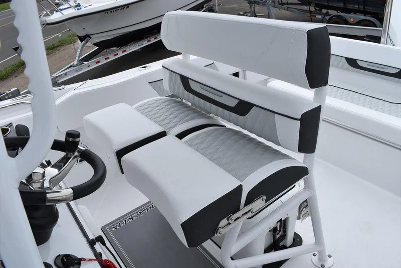 Slide: The Image of 2024 Blackfin 222CC boat seating and helm area, featuring modern design and comfort. - 37