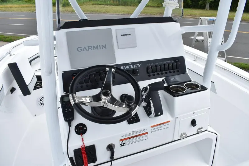 Slide: The Image of 2024 Blackfin 222CC boat console with Garmin navigation and Mercury controls. - 40