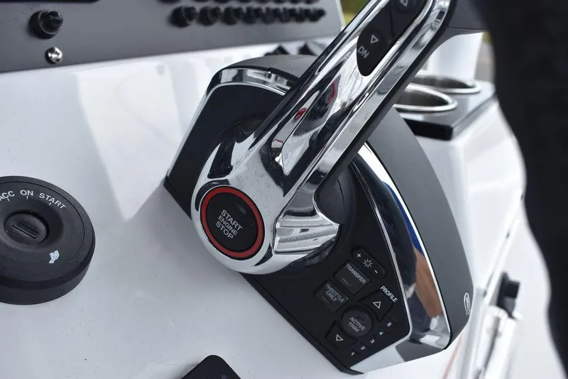 Slide: The Image of 2024 Blackfin 222CC boat throttle control with start/stop button. - 46