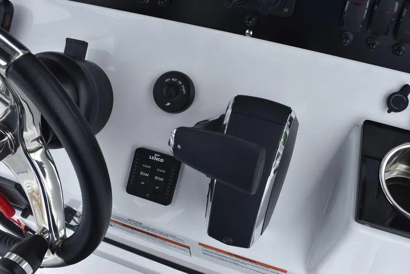 Slide: The Image of Close-up of 2024 Blackfin 222CC boat controls and steering wheel. - 47
