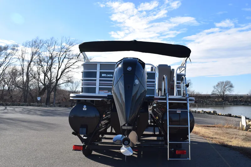 Slide: The Image of 2023 Ranger 223C pontoon boat with outboard motor and canopy. - 4