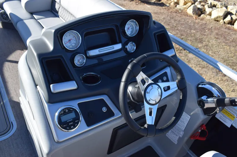 Slide: The Image of 2023 Ranger 223C boat dashboard with steering wheel and gauges. - 9