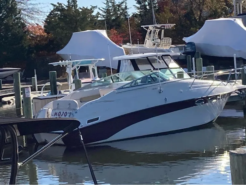 The Image of 2000 Crownline 268 boat docked at a marina. - 1