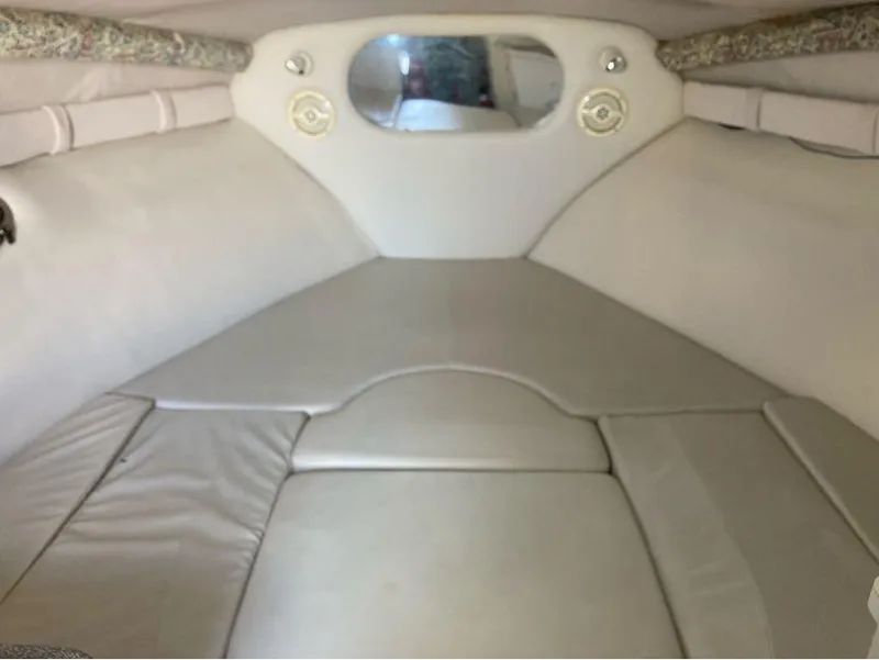 Slide: The Image of Interior cabin of a 2000 Crownline 268 boat with cushioned seating. - 7