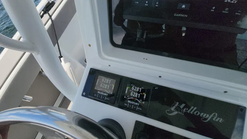 Slide: The Image of Close-up of 2005 Yellowfin 31 boat dashboard with Garmin display and controls. - 11