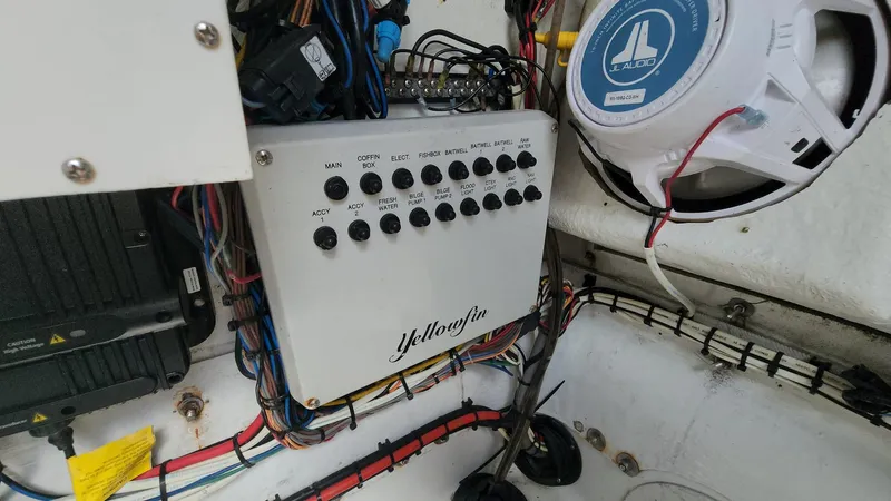 Slide: The Image of 2005 Yellowfin 31 boat electrical panel and speaker system. - 12