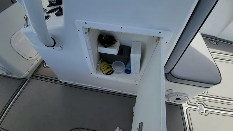Slide: The Image of Open storage compartment on 2005 Yellowfin 31 boat interior. - 16