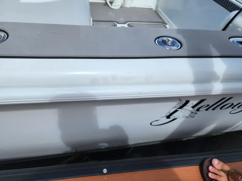 Slide: The Image of 2005 Yellowfin 31 boat side view with logo and deck details. - 18