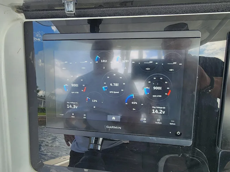 Slide: The Image of Garmin display on 2005 Yellowfin 31 boat showing engine and navigation data. - 19