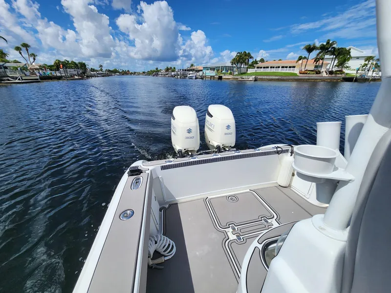 Slide: The Image of 2005 Yellowfin 31 boat on a scenic waterway with twin outboard engines. - 26