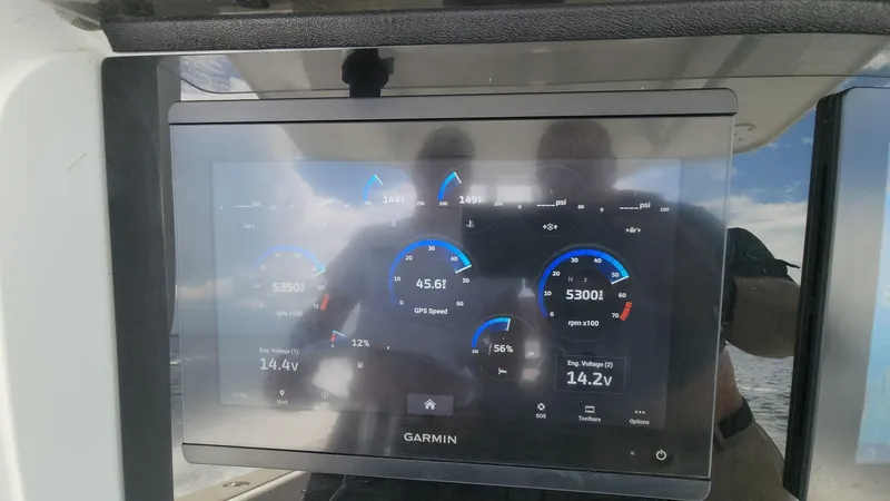 Slide: The Image of Garmin display on 2005 Yellowfin 31 boat showing engine and navigation data. - 37