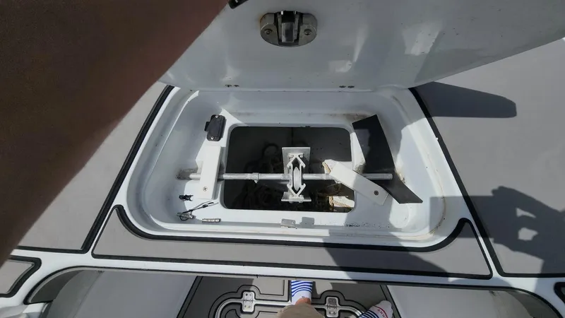 Slide: The Image of Open hatch on 2005 Yellowfin 31 boat deck, showing storage compartment. - 39