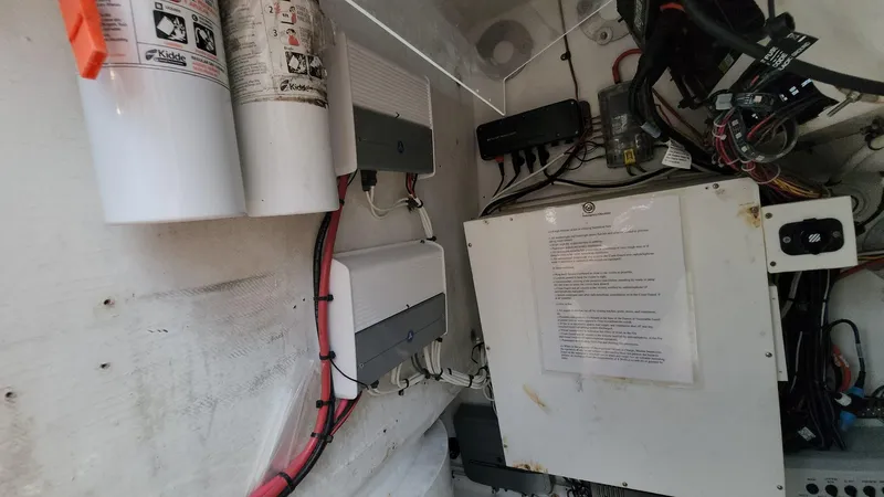 Slide: The Image of 2005 Yellowfin 31 boat electrical system with wiring and fire extinguishers. - 41